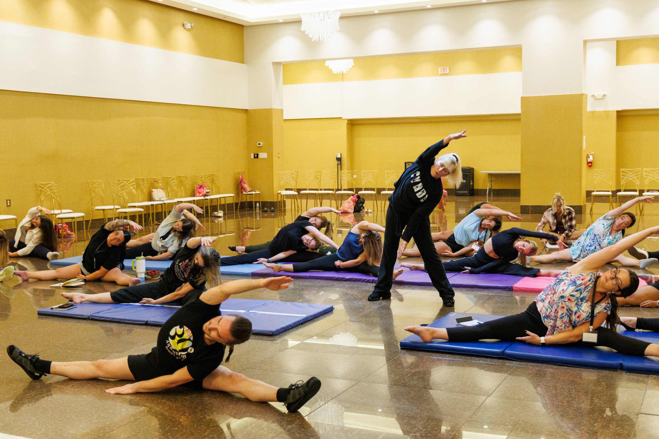 a group of people sitting and standing around each other